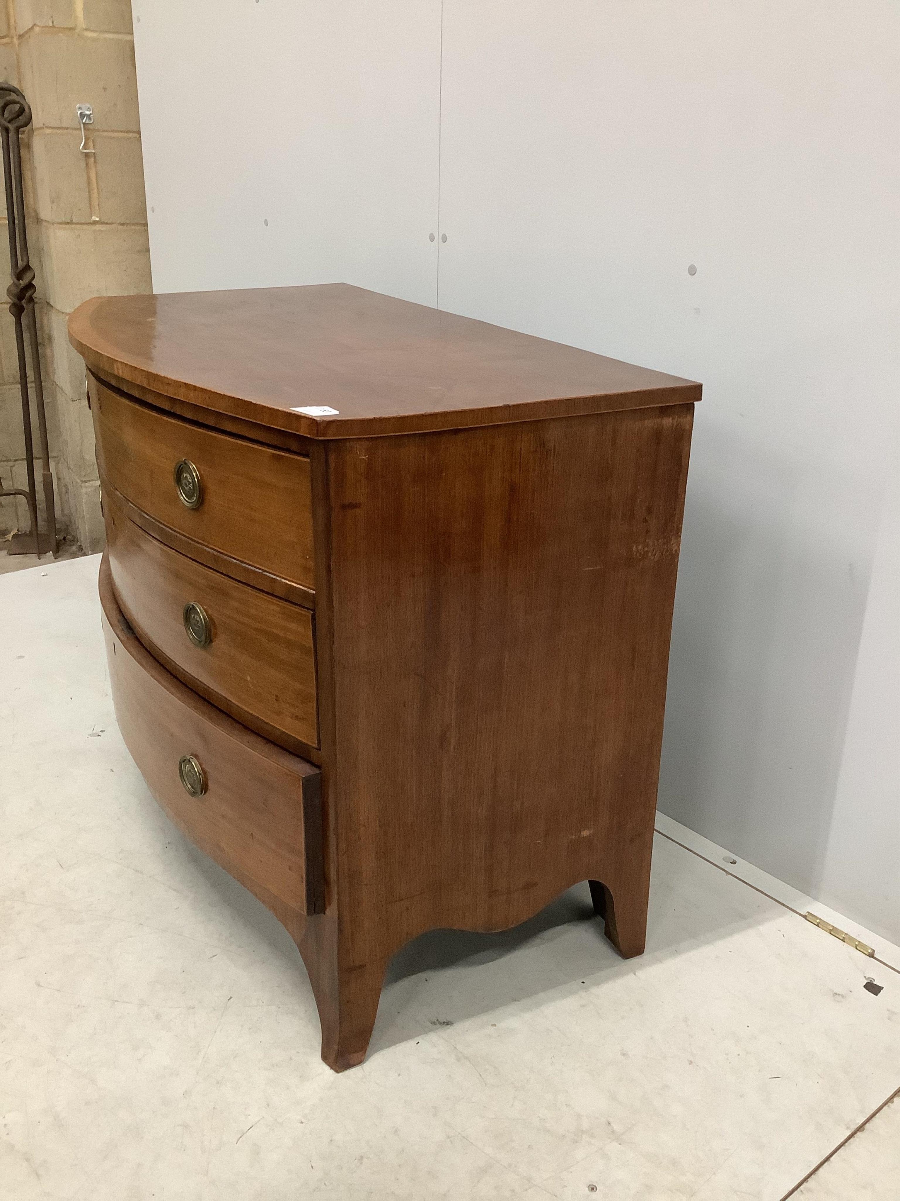 A Regency mahogany bow fronted chest of three drawers, width 109cm, depth 58cm, height 81cm. Condition - poor to fair, top badly marked